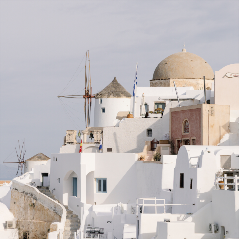 Whitewashed rooftops, windmills and traditional architecture in Oia, Santorini fine art print
