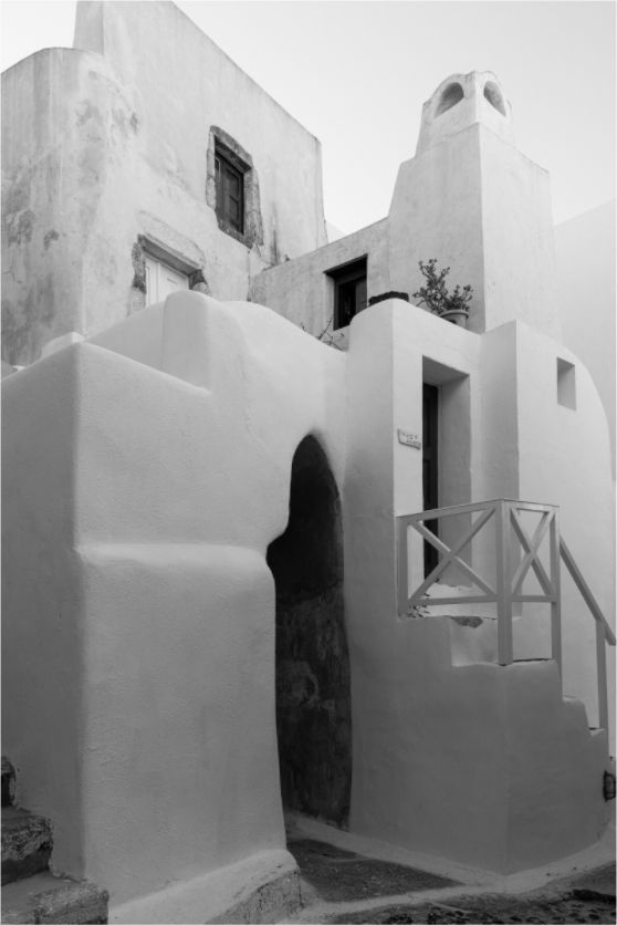 Black and white fine art photograph of traditional Cycladic architecture in Emborio, Santorini.