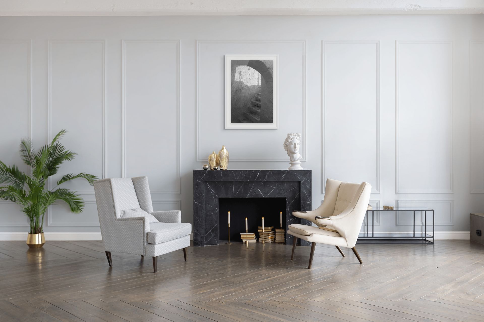 The Passage black and white Santorini wall art displayed above a black marble fireplace in a contemporary living room