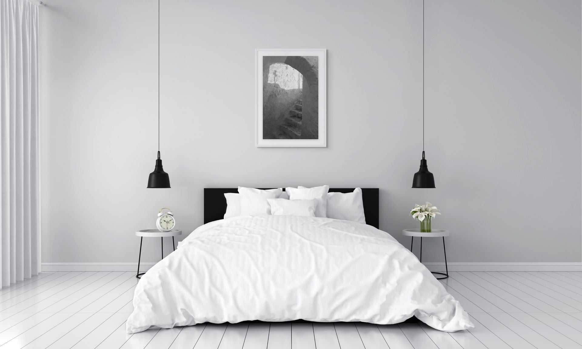 The Passage black and white photography print displayed above a modern bed in a minimalist bedroom. White frame and passe-partout